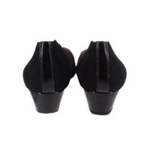 Black wedge flats heel view with low wedge heel and fabric back seam
