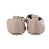 Taupe leather flats with low heel and stitched back, rear view