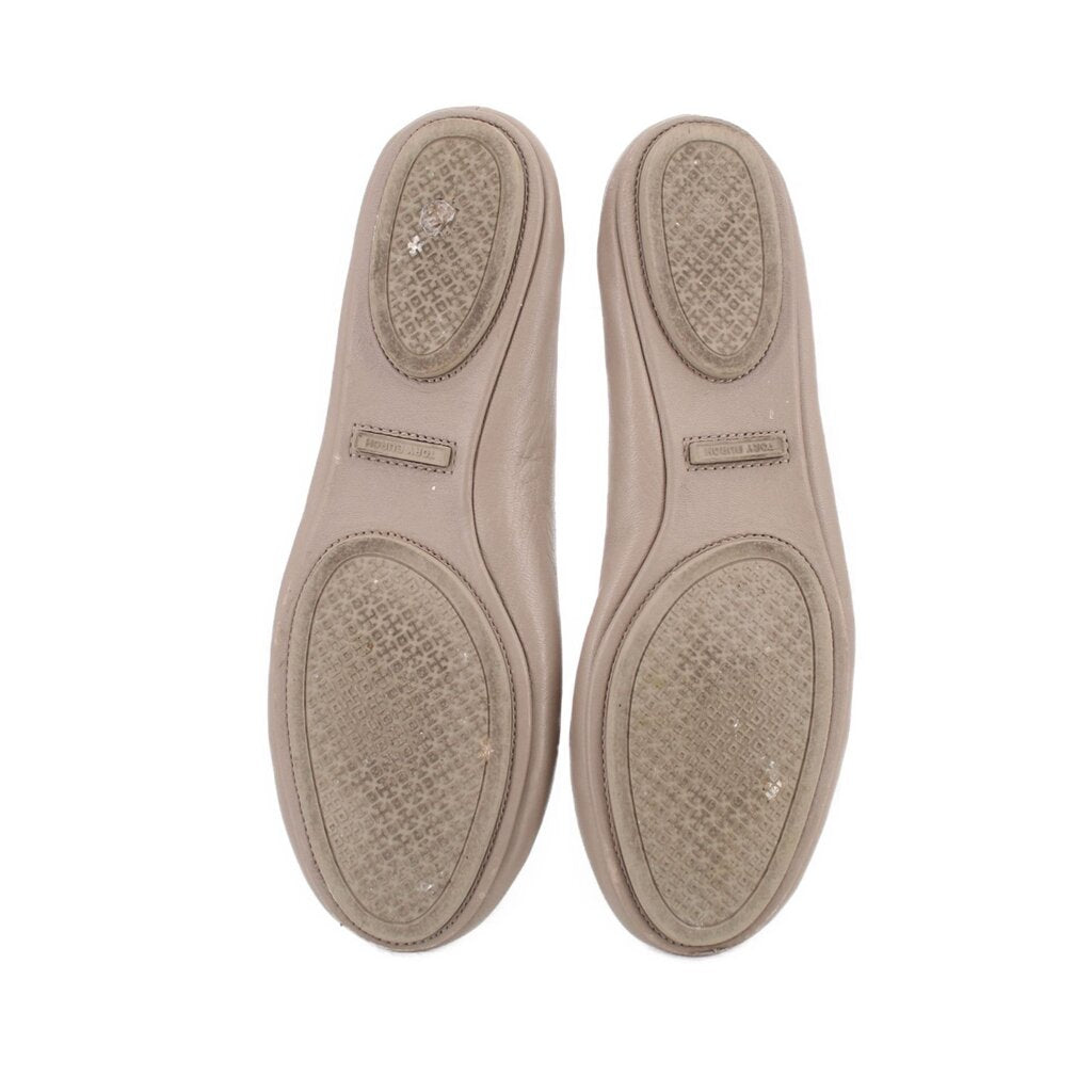 Taupe leather flat soles with textured outsole and small branding patch