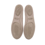 Taupe leather flat soles with textured outsole and small branding patch