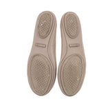 Taupe leather flat soles with textured outsole and small branding patch