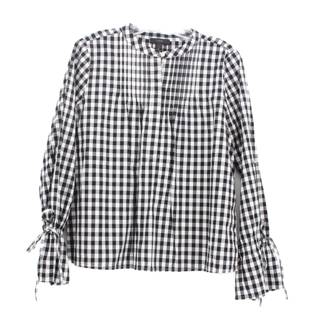 Black-and-white gingham button-up top with long sleeves and tie cuffs