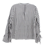 Black and white gingham check blouse back with tied sleeve cuffs