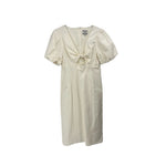 Women's cream maxi dress with puff sleeves, V-neck, and gathered waist tie