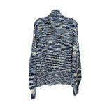 Turtleneck knit sweater with blue/cream patchwork stripes, ribbed hem