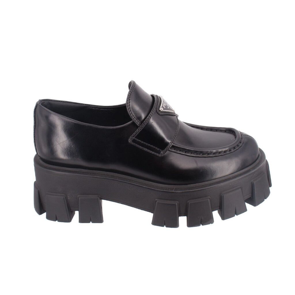 Black leather loafer with strap detail and chunky lug platform outsole