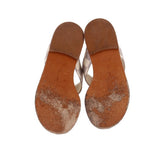 Thong sandal outsoles with textured brown leather soles and checkerboard straps