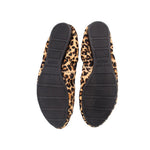 Leopard print shoe outsoles with black tread, durable rubber bottom
