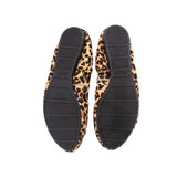 Leopard print shoe outsoles with black tread, durable rubber bottom