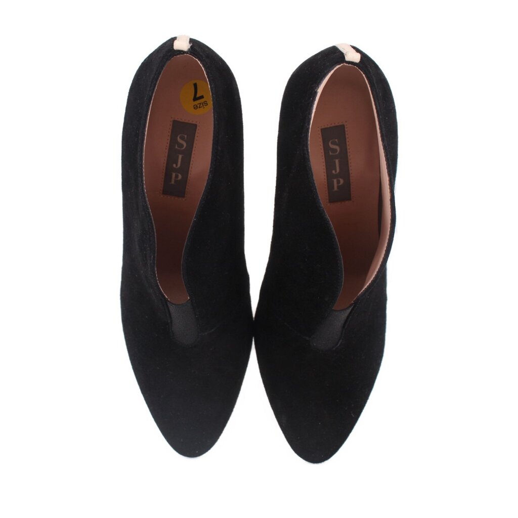 Black suede heeled booties with pointed toes, tan interior lining and SJP label