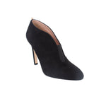 Black suede pointed-toe heeled bootie with stiletto heel, side cutout