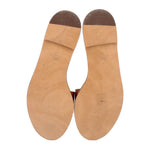 Brown leather sandal soles with size markings on underside