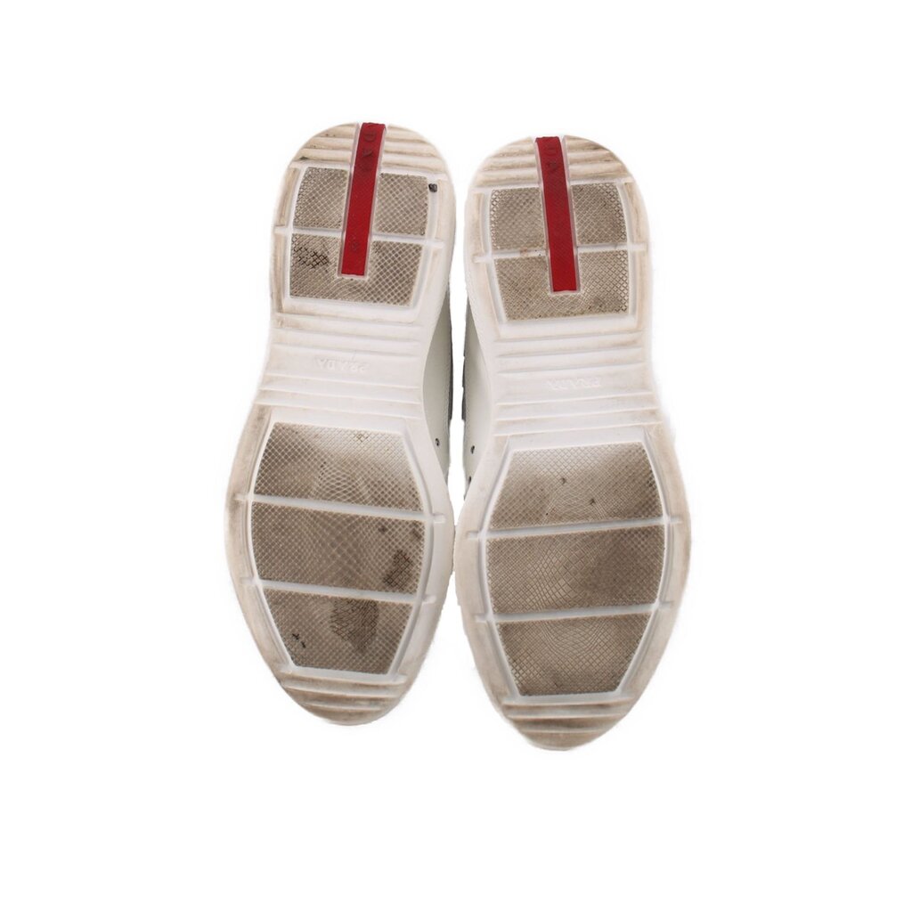 America's Cup sneakers outsole view, textured tread with white rubber and red strip
