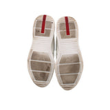America's Cup sneakers outsole view, textured tread with white rubber and red strip