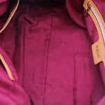 Colette shoulder bag interior lining with magenta fabric and gold zipper trim