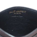 Black leather card case interior stamped 'SAINT LAURENT PARIS'