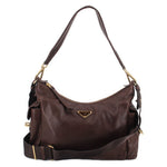 Prada Explorer crossbody bag in brown with gold-tone hardware and adjustable strap