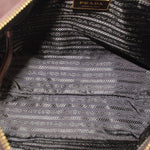 Interior fabric of PRADA crossbody bag with repeating pattern and PRADA label