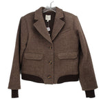 Brown herringbone jacket with notched lapels, button front, flap pockets, ribbed hem