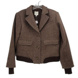 Brown herringbone jacket with notched lapels, button front, flap pockets, ribbed hem