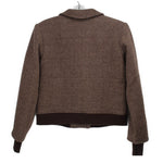 Brown herringbone jacket back view with yoke seam and ribbed cuffs and hem