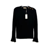Black bell-sleeve sweater with crew neck and small gold emblem at neckline