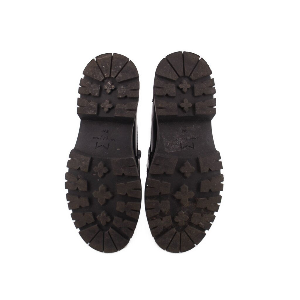 Black platform loafer outsoles with star-pattern rubber tread