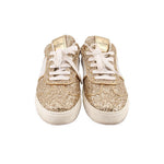 Pair of glitter sneakers with front laces and gold sparkle finish