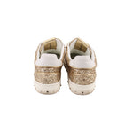 Back view of glitter sneakers with white heel tabs and gold sparkle uppers