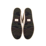 Glitter sneaker outsoles with textured rubber tread