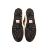 Glitter sneaker outsoles with textured rubber tread