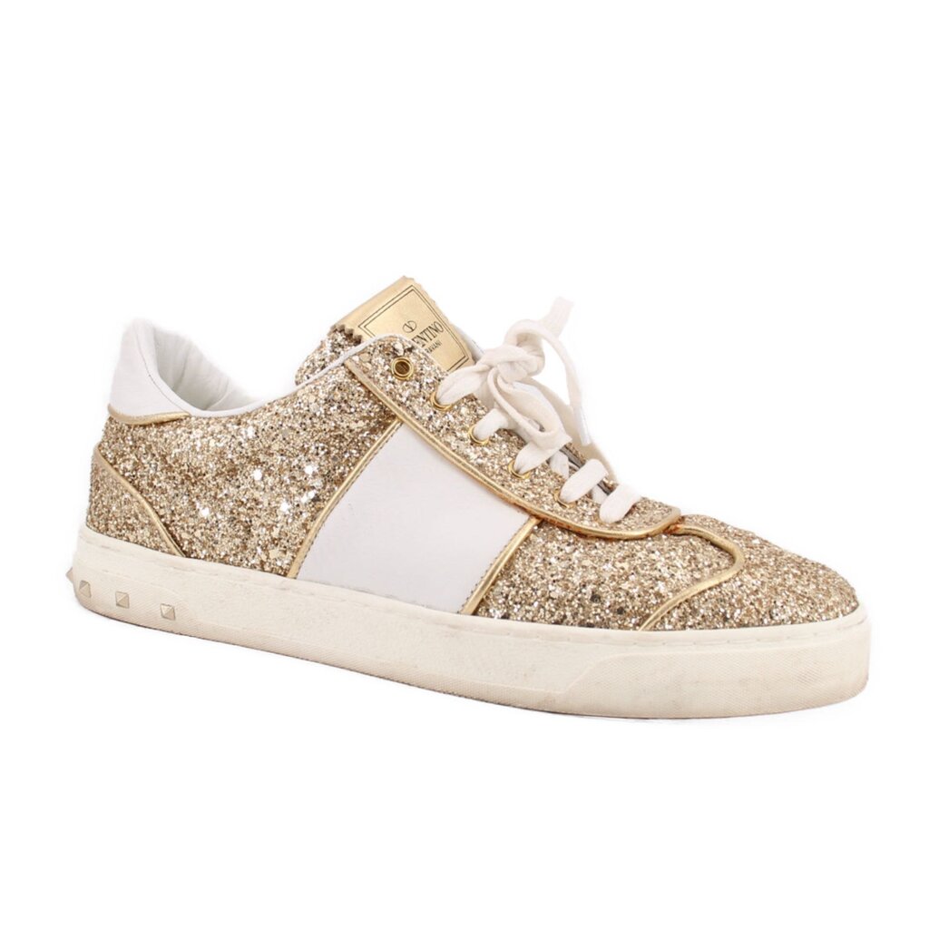 Low-top glitter sneakers with white laces, gold sparkle panels and white sole