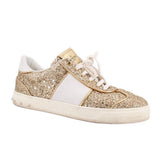 Low-top glitter sneakers with white laces, gold sparkle panels and white sole