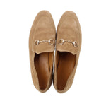Pair of tan suede horsebit loafers, front view with metal bit hardware