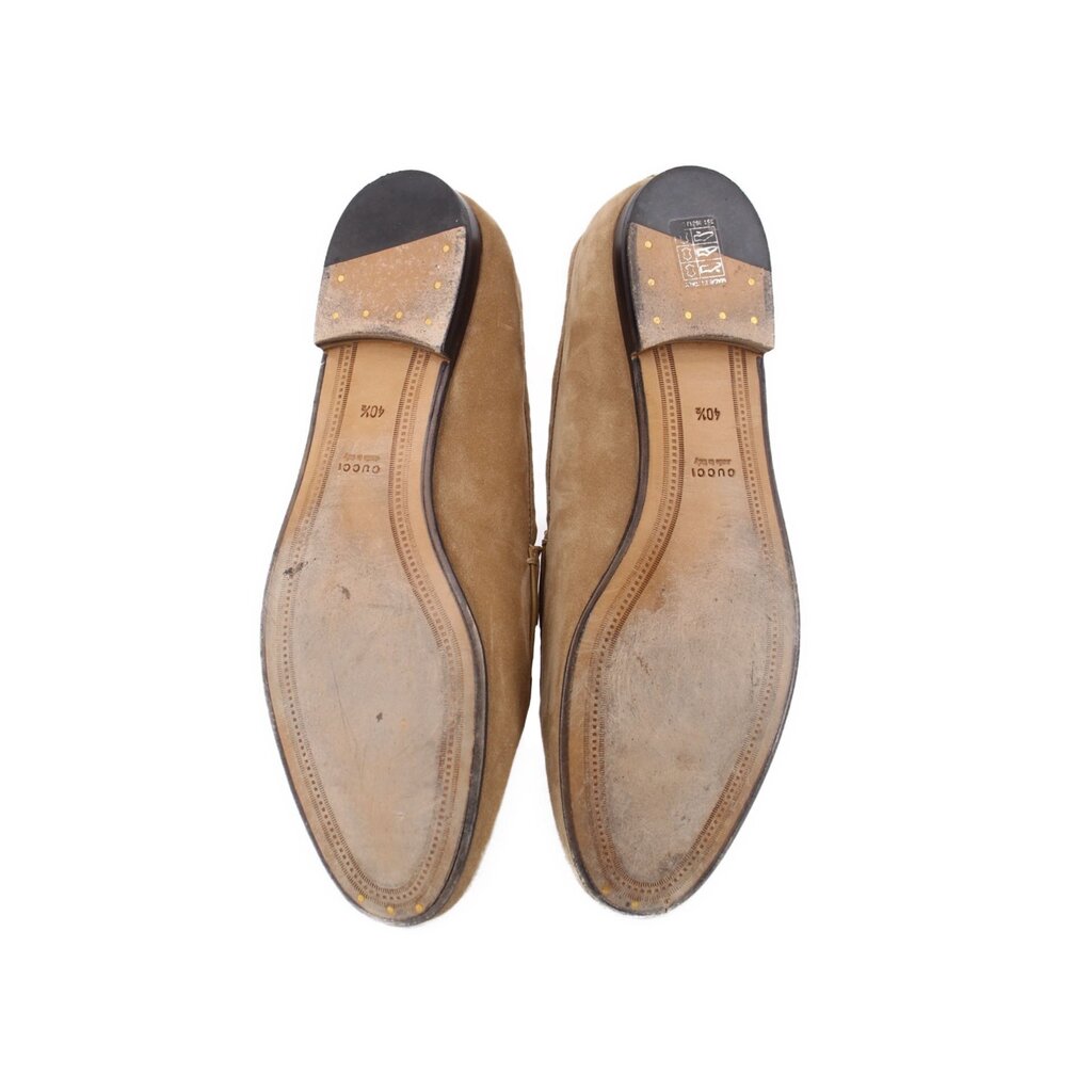 Tan suede horsebit loafers, bottom view showing leather sole underside