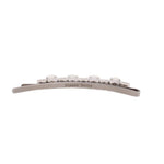 Silver hair clip with row of clear stones and engraved Simone Rocha on bar