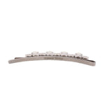 Silver hair clip with row of clear stones and engraved Simone Rocha on bar