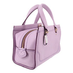 Mini crossbody bag detail: zip pocket, strap, and gold-tone clasp hardware