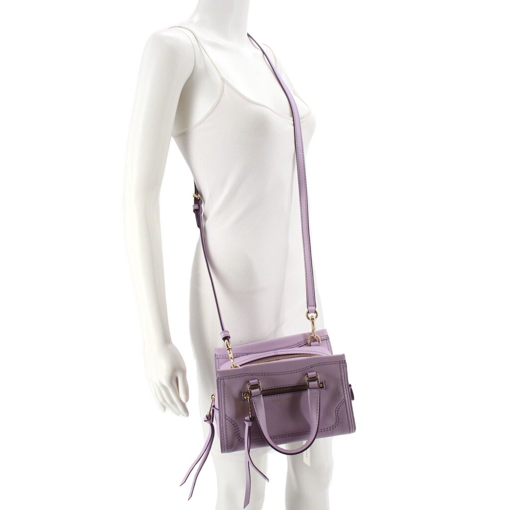 Mini crossbody bag on mannequin with adjustable purple strap and zip pocket