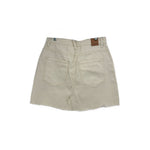 Cream denim mini skirt, back view with two patch pockets and waistband tag