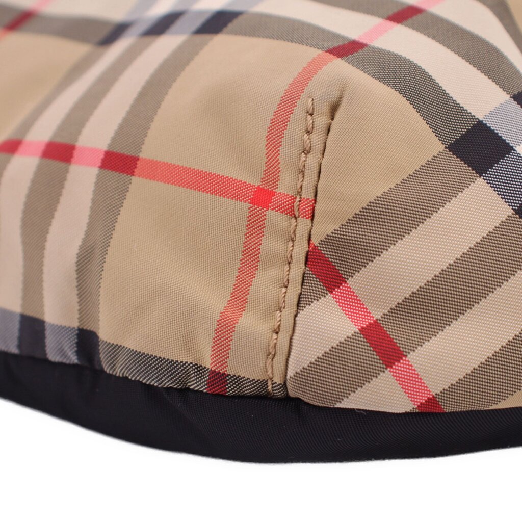 BURBERRY belt bag close-up of tan check panel seam and black fabric edge