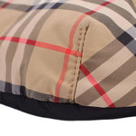 BURBERRY belt bag close-up of tan check panel seam and black fabric edge