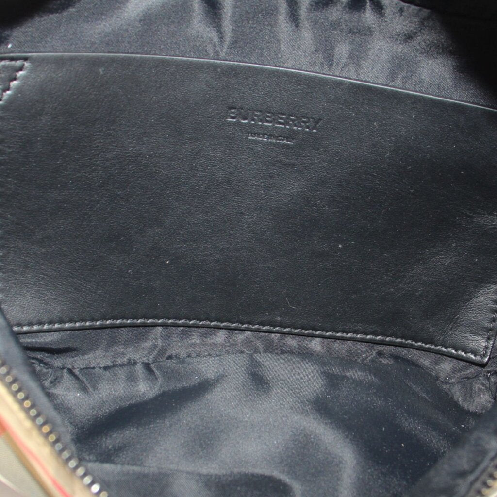 BURBERRY belt bag interior with black lining and small logo stamp on leather patch