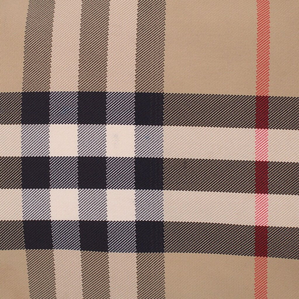 BURBERRY check fabric panel texture in tan, navy, red, and white