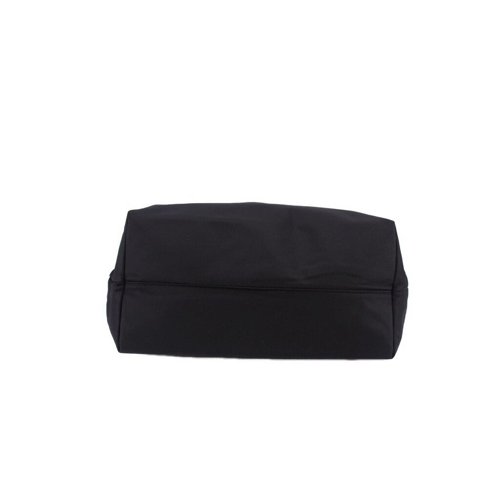 Black tote bag with flat folded top and smooth structured base
