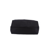 Black tote bag with flat folded top and smooth structured base