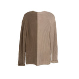 Tan cable-knit sweater with textured knit detail and long sleeves, crew neckline.