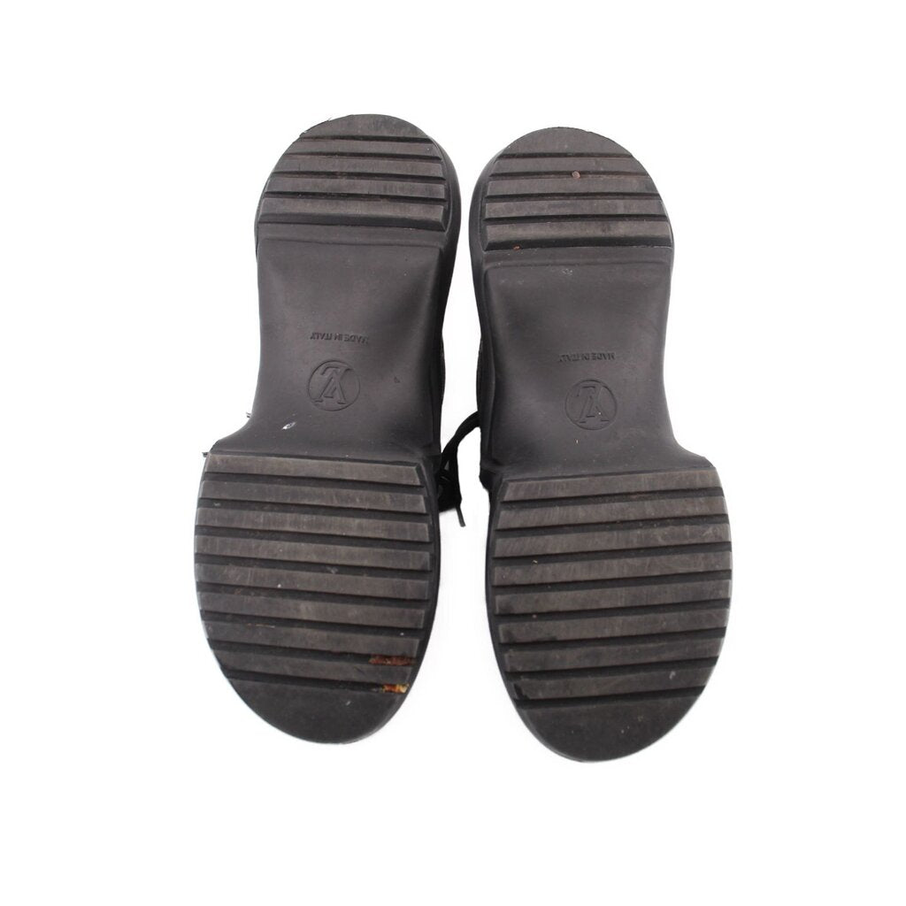 Sneaker outsoles, dark rubber tread with brand logo marks