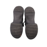 Sneaker outsoles, dark rubber tread with brand logo marks