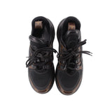 Pair of Archlight sneakers front view, black mesh with tan monogram toe accents